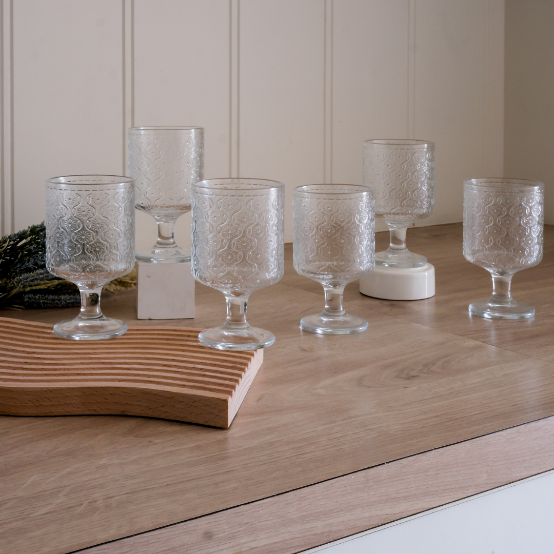 Clear flower embossed juice glasses with textured grip and weighted base