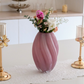 Elegant flower vase with fresh flowers on dining table