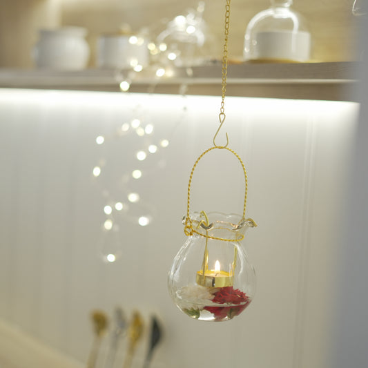 Glass vase with scalloped edges and gold lantern chain
