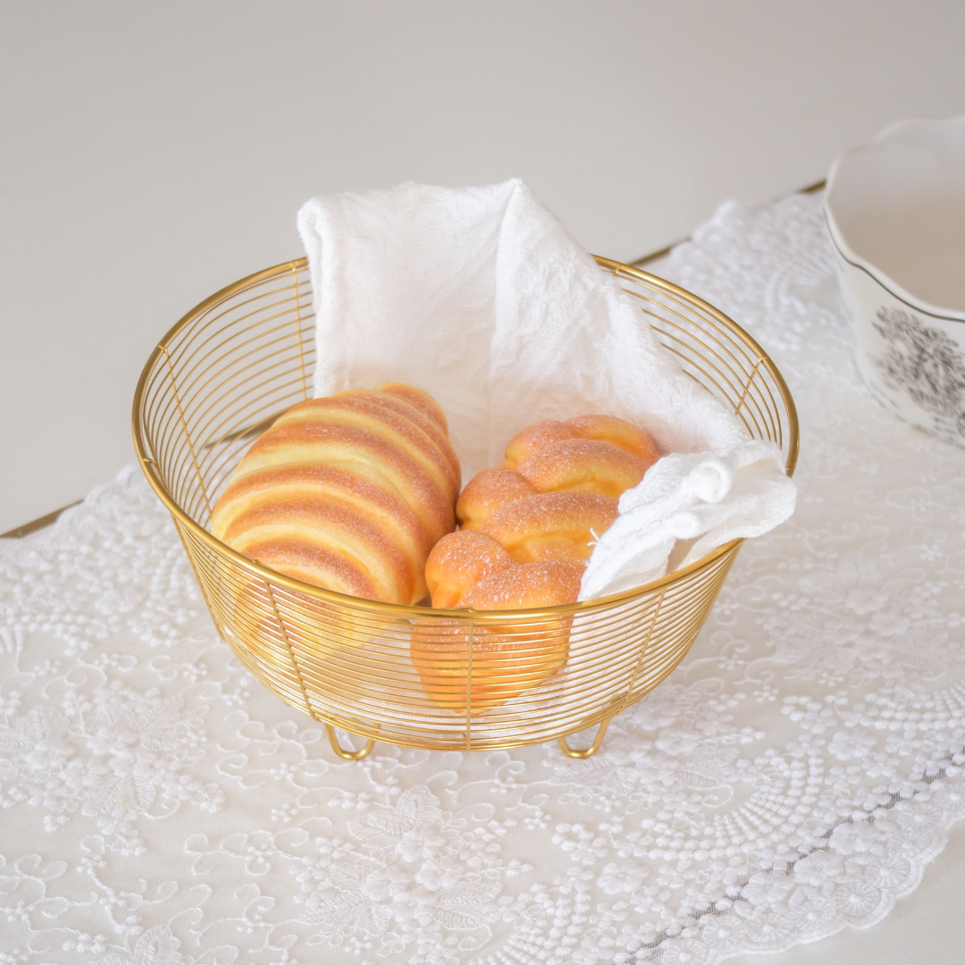 Gold bread basket for serving bread and rolls at the table