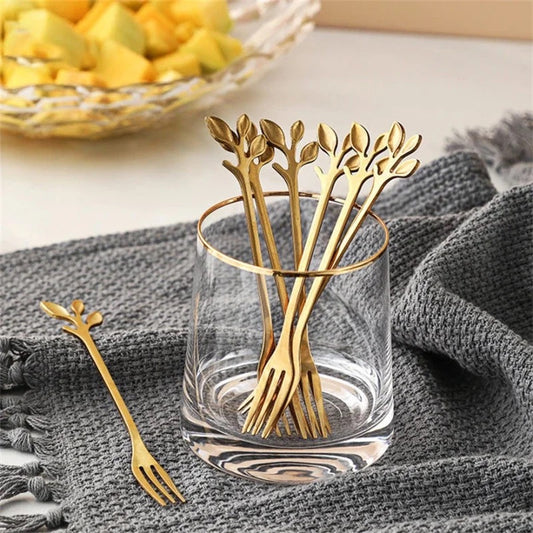 Luxury gold dessert forks with elegant leaf handle design for serving fruits and desserts