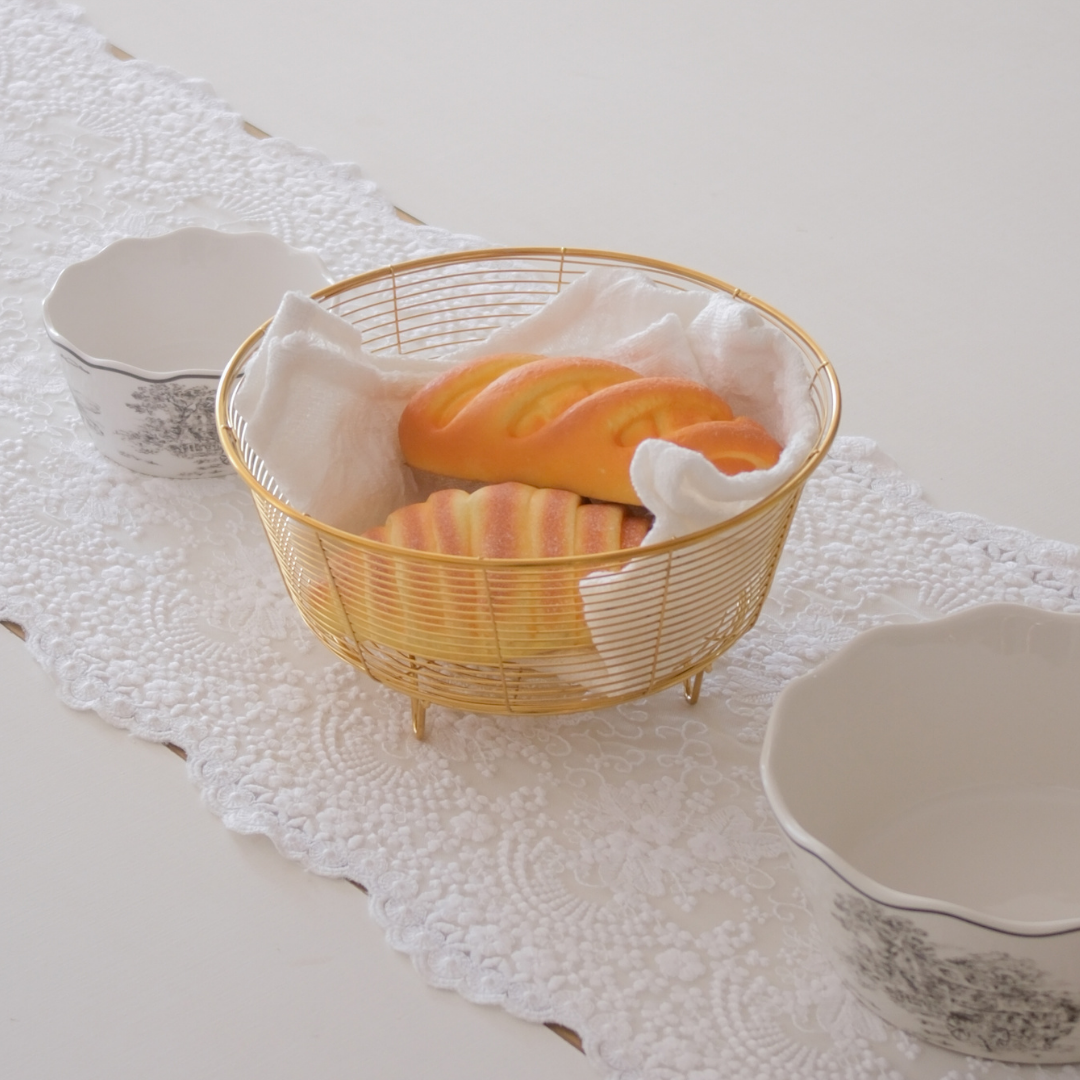 Gold metal wire basket for serving bread and fruits