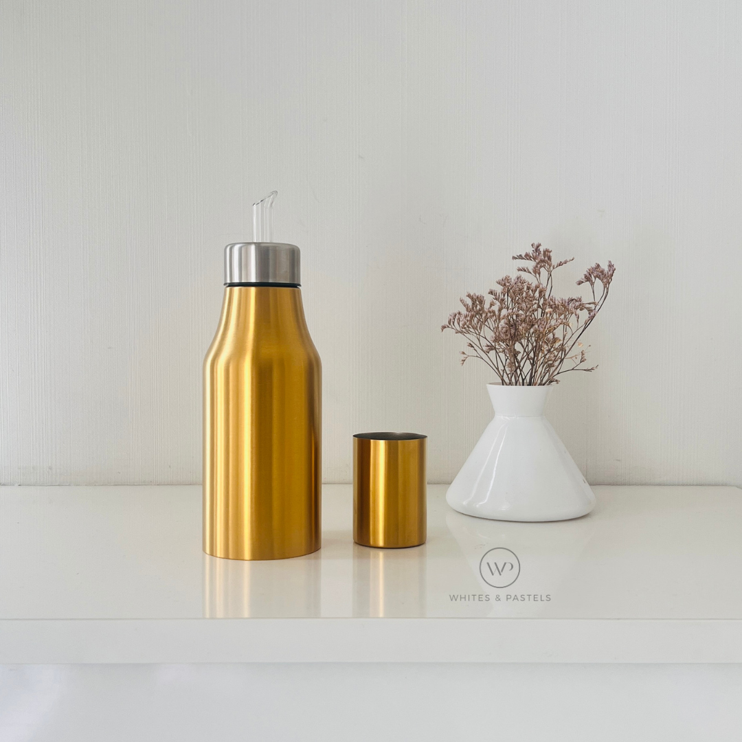 Modern oil pourer with gold PVD finish for olive oil and sauces