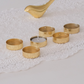 Elegant gold tea light holders creating a luxurious dining table centrepiece