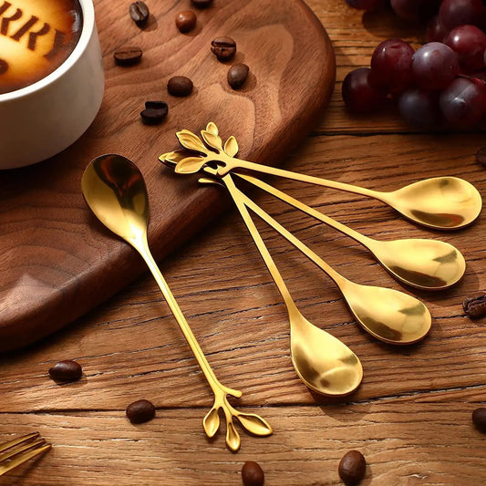 Gold leaf shaped stainless steel dessert spoons with elegant mirror finish for tea, coffee and desserts