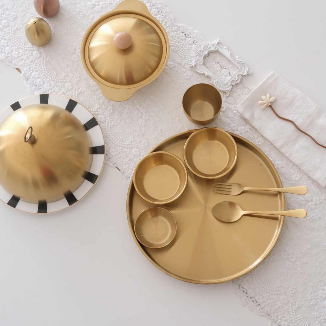 Complete luxury thali set placed over white runner in dining table with cloche and serving bowl ready to serve lunch