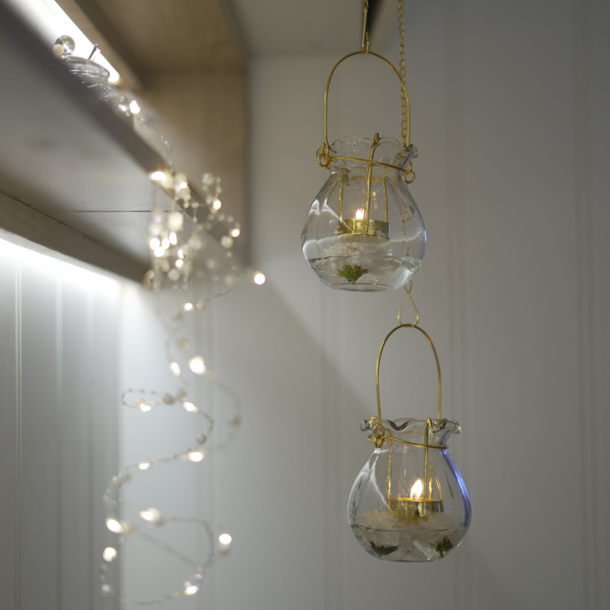 Hanging candle lantern with gold finish and 12-inch chain