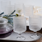 Elegant clear glass juice glasses with textured bubble design
