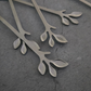 Modern stainless steel leaf design forks for premium dining and entertaining