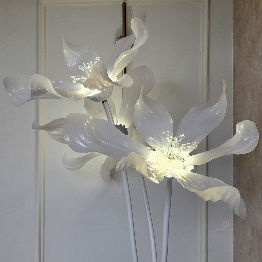 Elegant lily flower LED floor lamp with three sculpted floral lights.