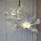 Elegant lily flower LED floor lamp with three sculpted floral lights.