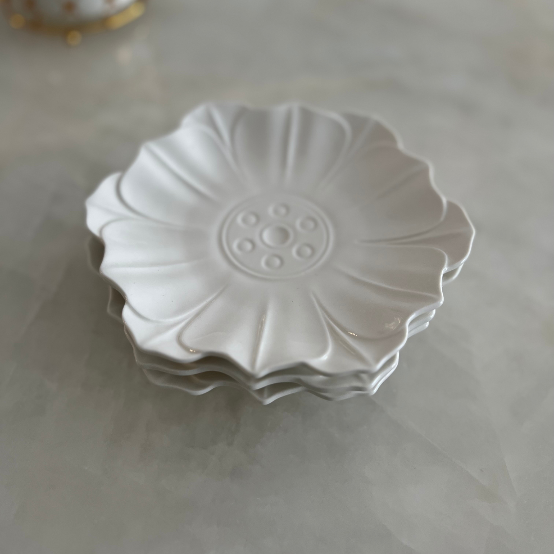 Small White Porcelain plate in the shape of a lotus. Can be used for serving Desserts and snacks.