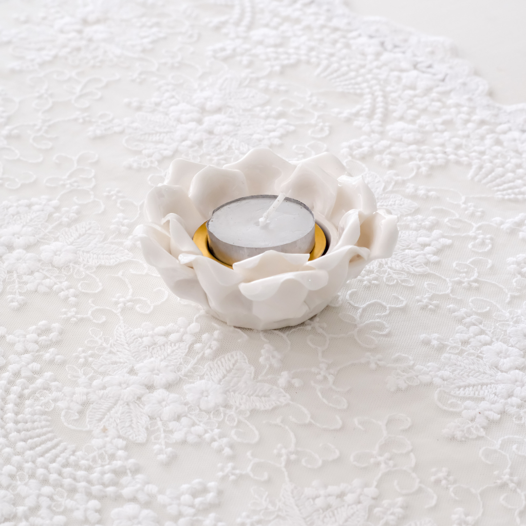 Top view of white ceramic lotus tea light holder with layered petals