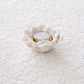 Top view of white ceramic lotus tea light holder with layered petals