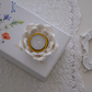 White lotus tea light holder creating a warm bedroom ambience