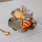 Decorative two-tier metal tray for serving cupcakes, cookies, and finger foods.