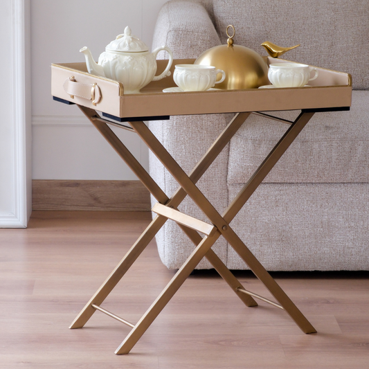 Detailed view of the beige serving tray corner featuring leather handle, gold finish and decorative bird accent.