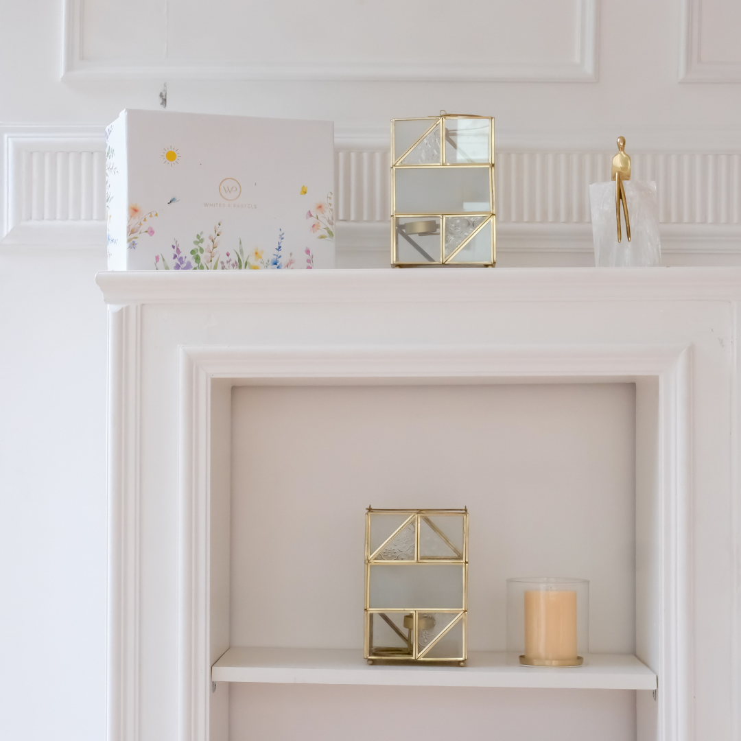 Luxury glass candle holder with gold accents, perfect for creating warm ambient lighting in modern homes.