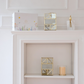 Luxury glass candle holder with gold accents, perfect for creating warm ambient lighting in modern homes.