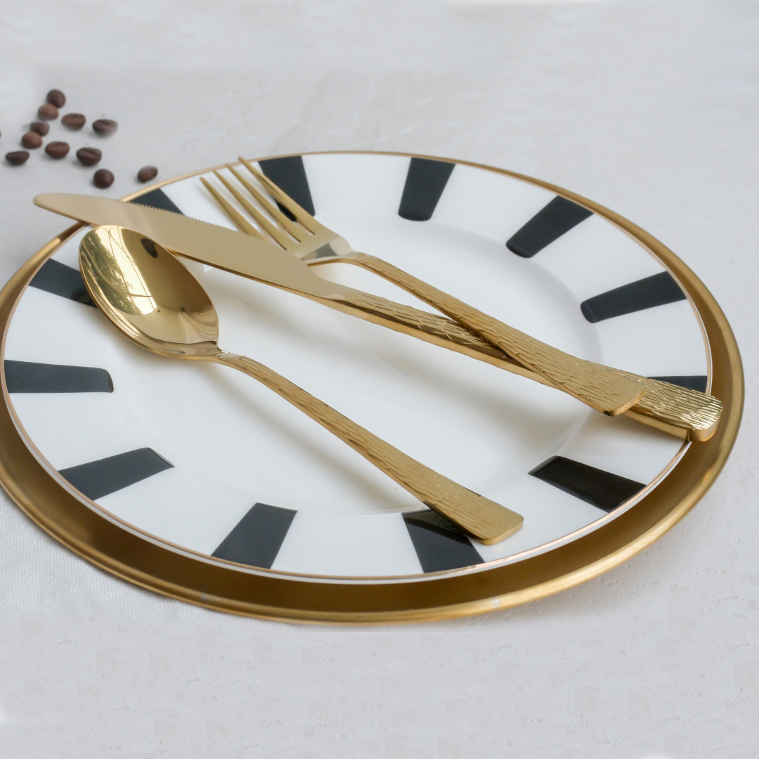 Premium SS304 gold flatware set featuring textured handles for a refined dining and dessert table setup.