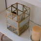 Premium gold metal and glass candle lantern creating a warm ambient glow for modern interiors.