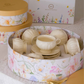 Premium ivory porcelain tea cup and saucer set beautifully arranged inside a floral luxury gift box.
