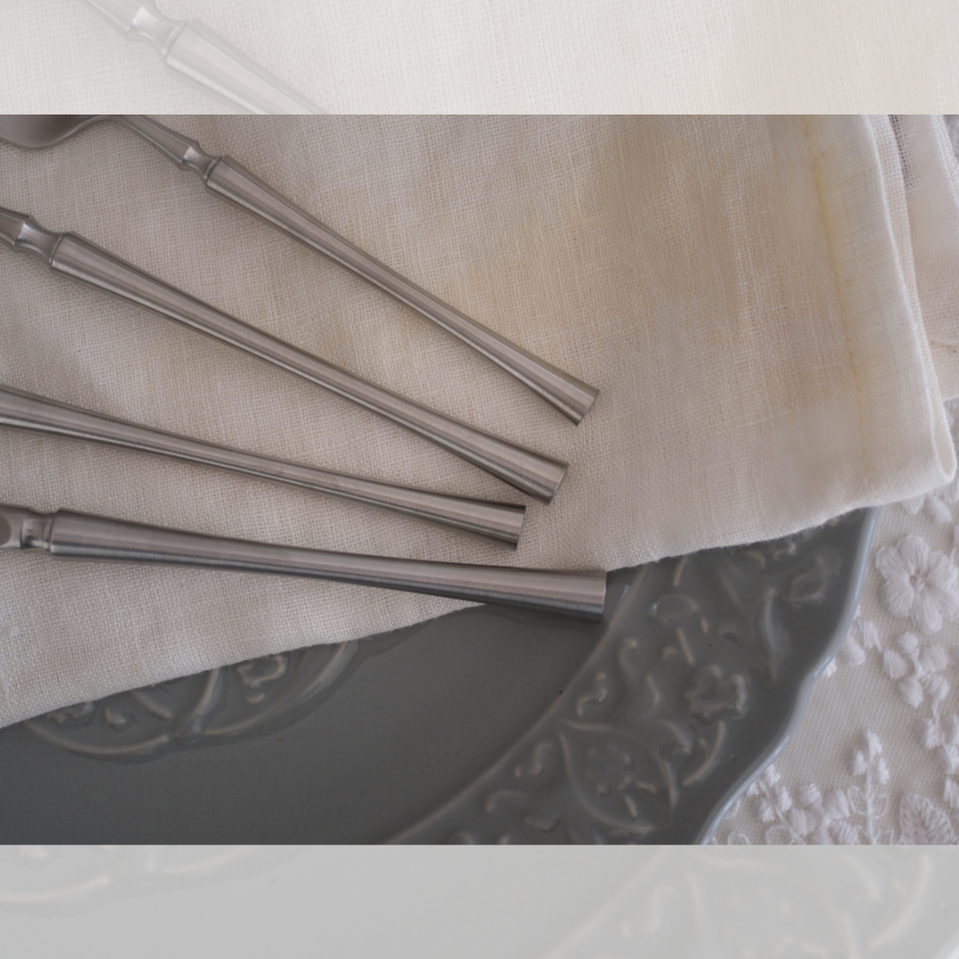 Detailed Close up for 5 Piece Silver Cutlery Set seen on white runner with Napkin