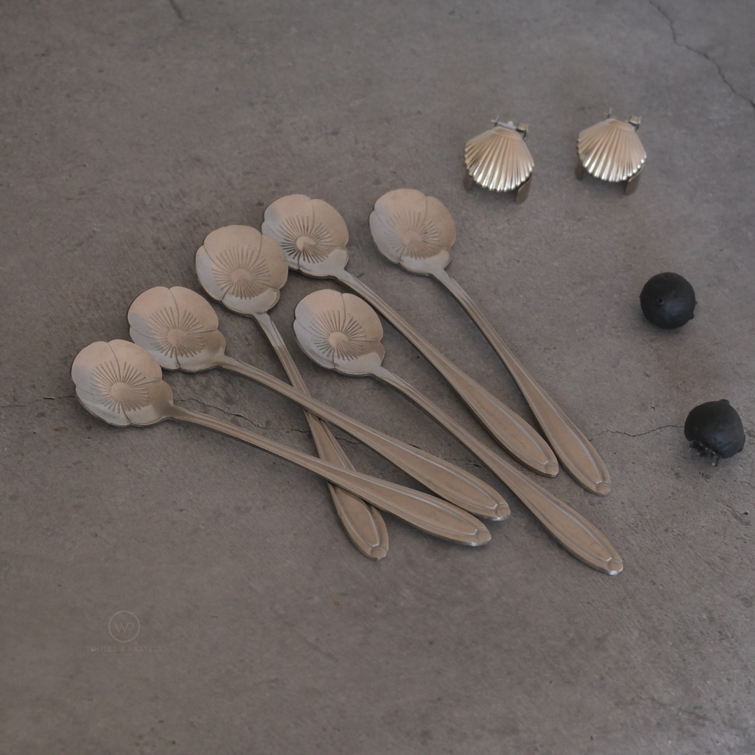 Elegant silver stainless steel daisy spoon set for serving desserts, tea and coffee