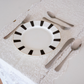 Dining table setup with black and white plate and ss304 luxury spoons, forks and knife