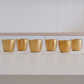 Gold glasses on white runner