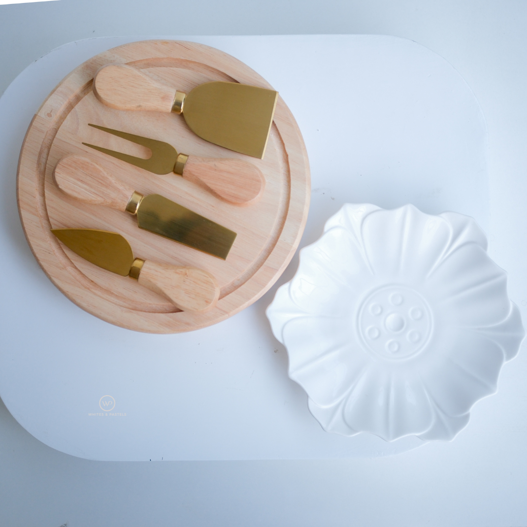 Luxury cheese serving platter with rotating wooden storage box and cheese accessories.