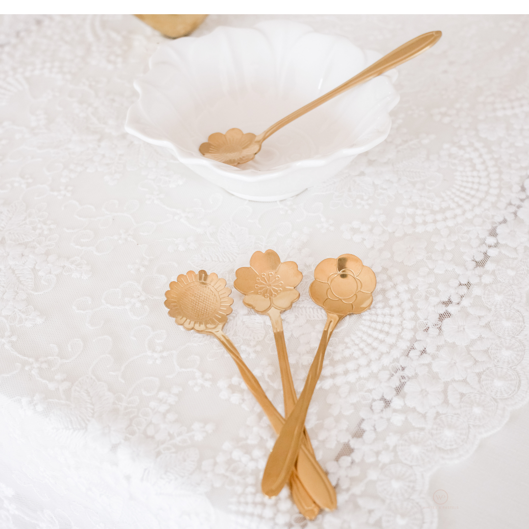 Decorative coffee spoons featuring unique embossed floral designs and a luxurious gold finish.