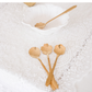 Decorative coffee spoons featuring unique embossed floral designs and a luxurious gold finish.