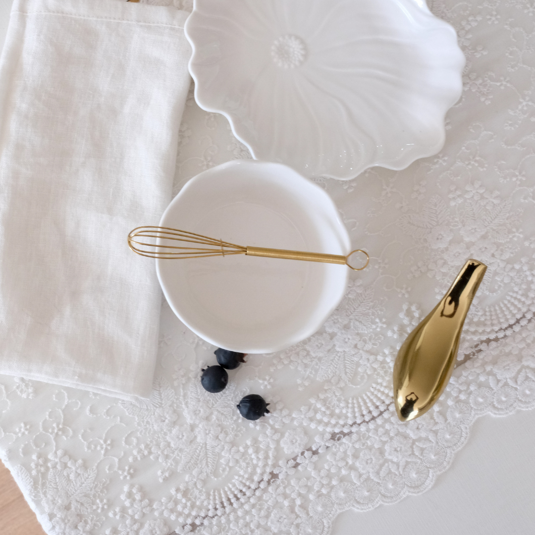 breakfast egg whisker placed on a dreamy white runner background