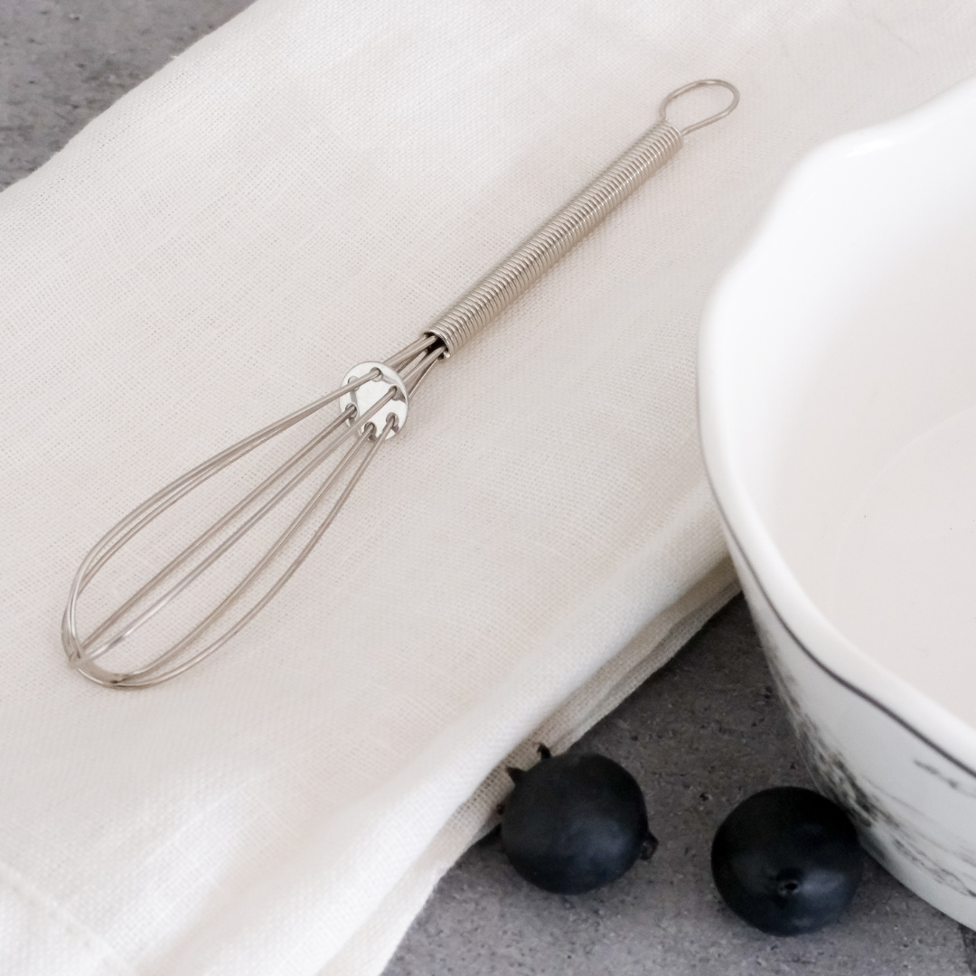 Silver whisker placed on  soft napkin