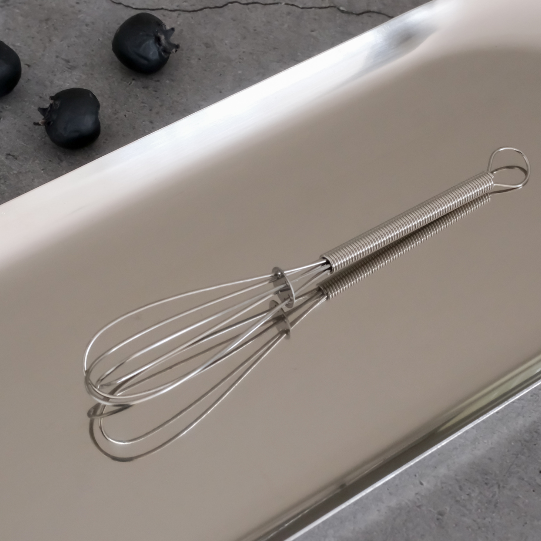 Whites & Pastels mini stainless steel whisk available in Gold and Silver finishes