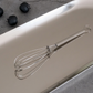 Whites & Pastels mini stainless steel whisk available in Gold and Silver finishes