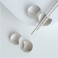 Minimalist stainless steel utensil rest set in silver finish