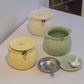 Pastel ceramic ghee container with matching lid,filter and spoon. Ideal for storing homemade ghee and butter.