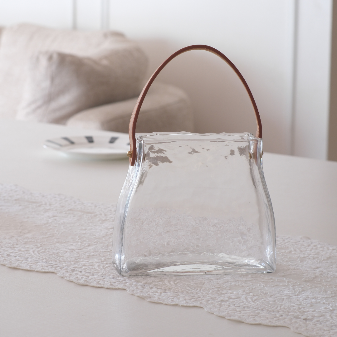 Premium  Transparent hammered glass drink dispenser with leather strap for stylish entertaining.