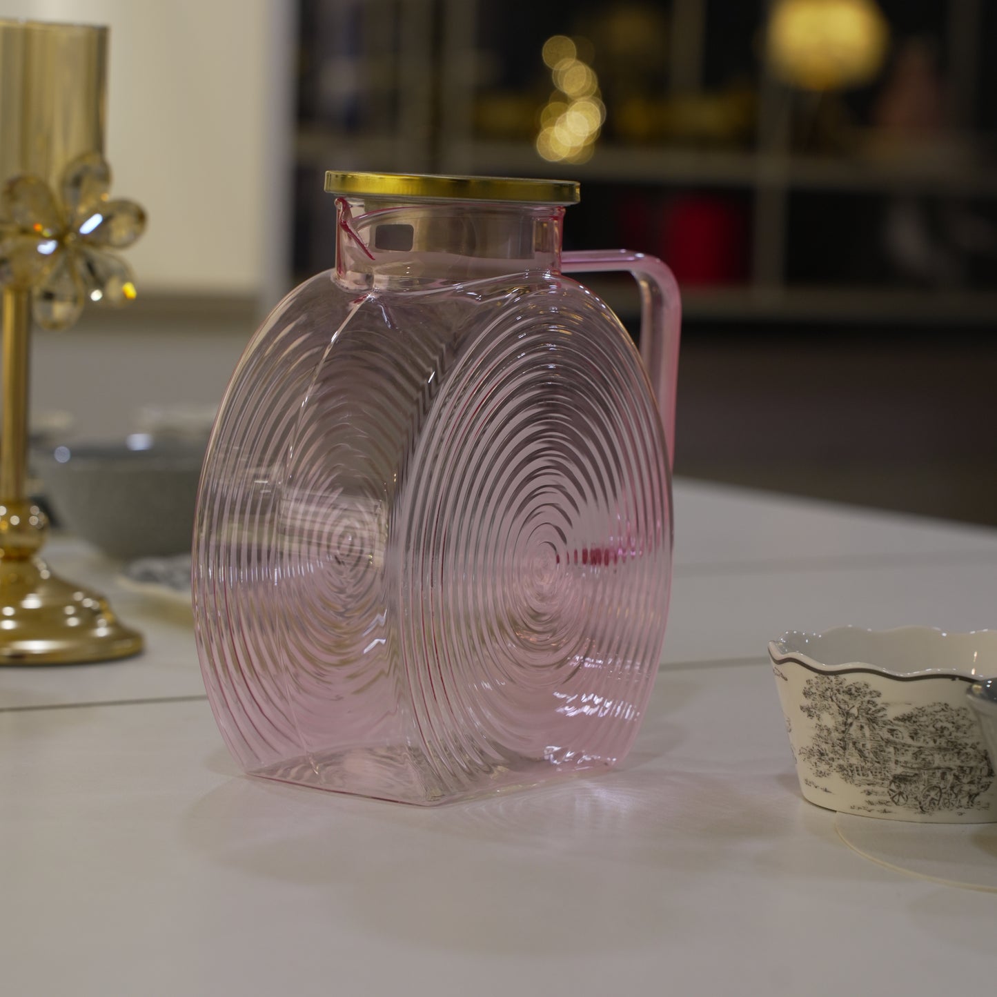 elegant glass carafe with gold lid for modern dining