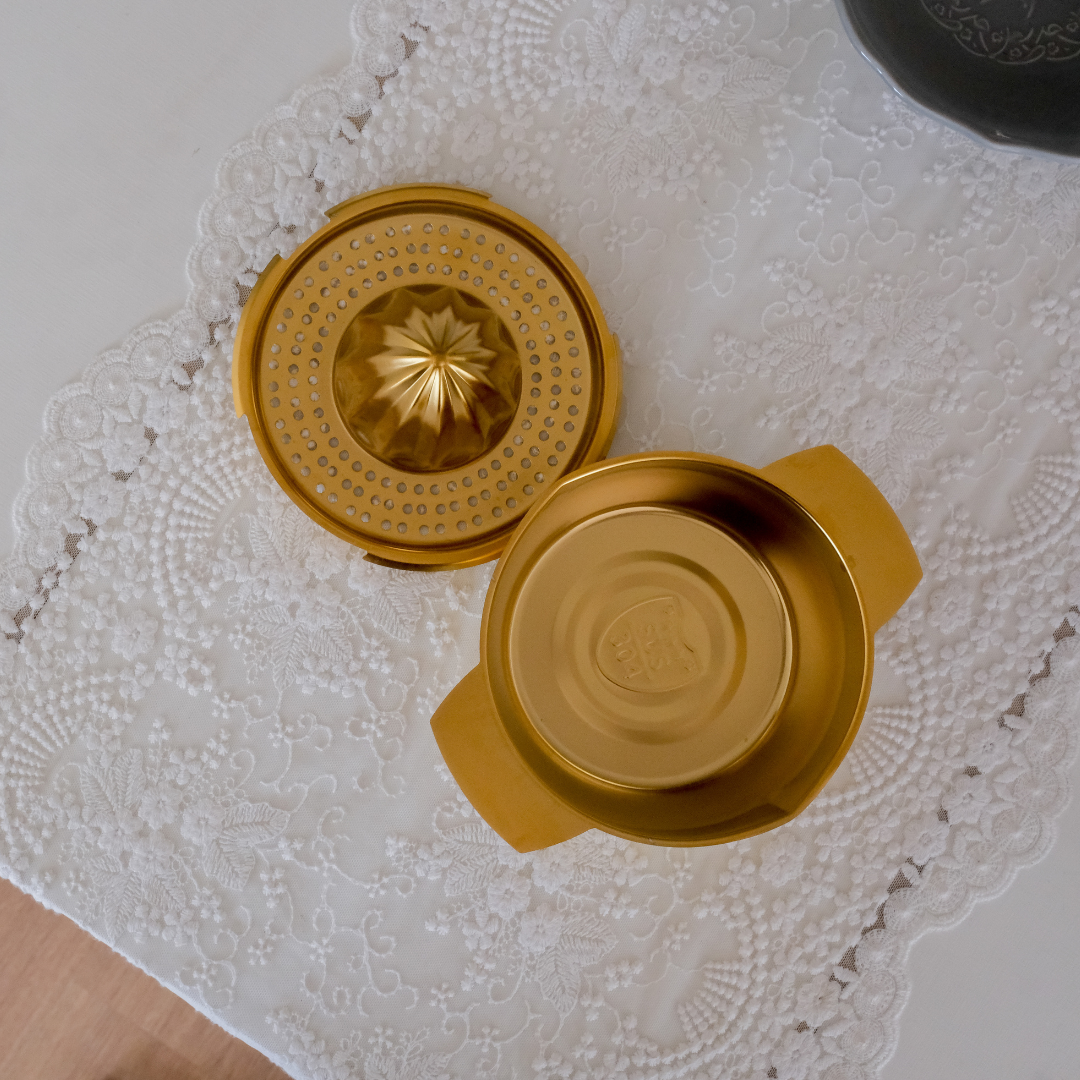 Premium tabletop citrus juicer in gold finish for extracting fresh lime and lemon juice