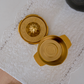 Premium tabletop citrus juicer in gold finish for extracting fresh lime and lemon juice