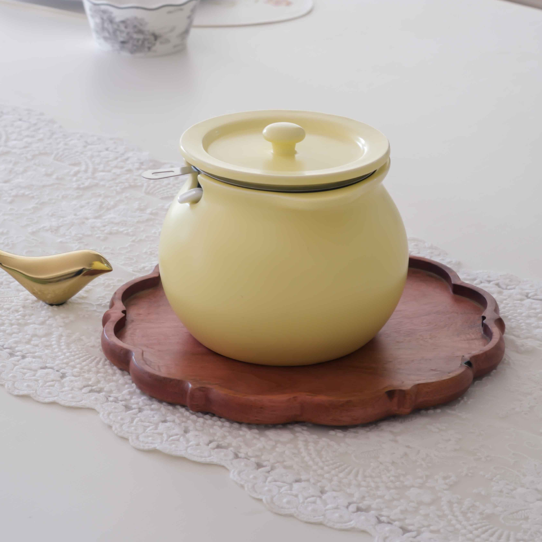 Elegant ceramic ghee storage jars with airtight lids for modern Indian kitchens.