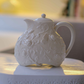 Premium ceramic teapot with embossed floral and butterfly detailing