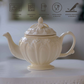 
Victorian embossed ivory tea pot crafted from premium porcelain, perfect for luxury high tea gatherings.