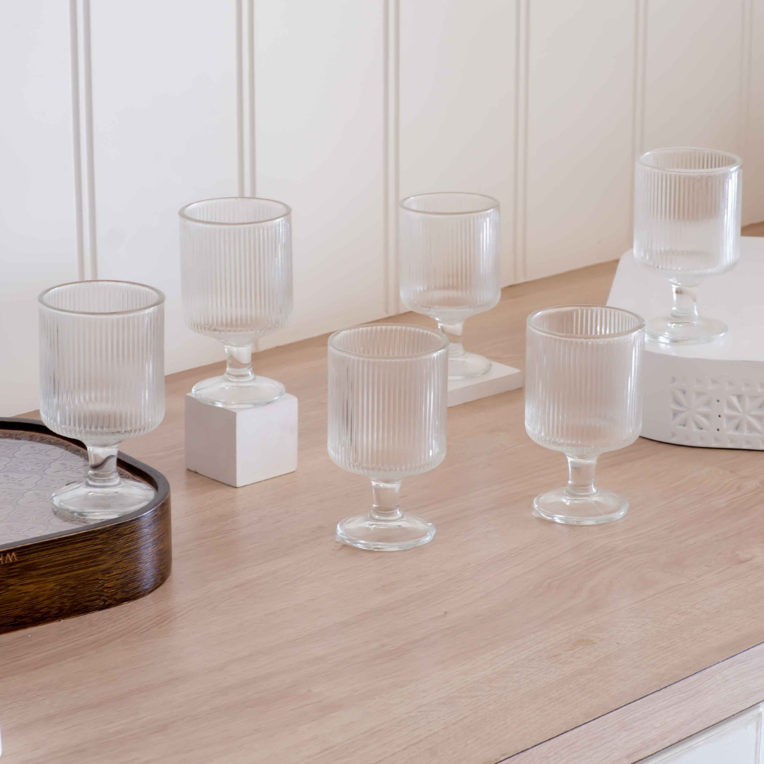 Clear fluted drinking glasses with stemmed design
