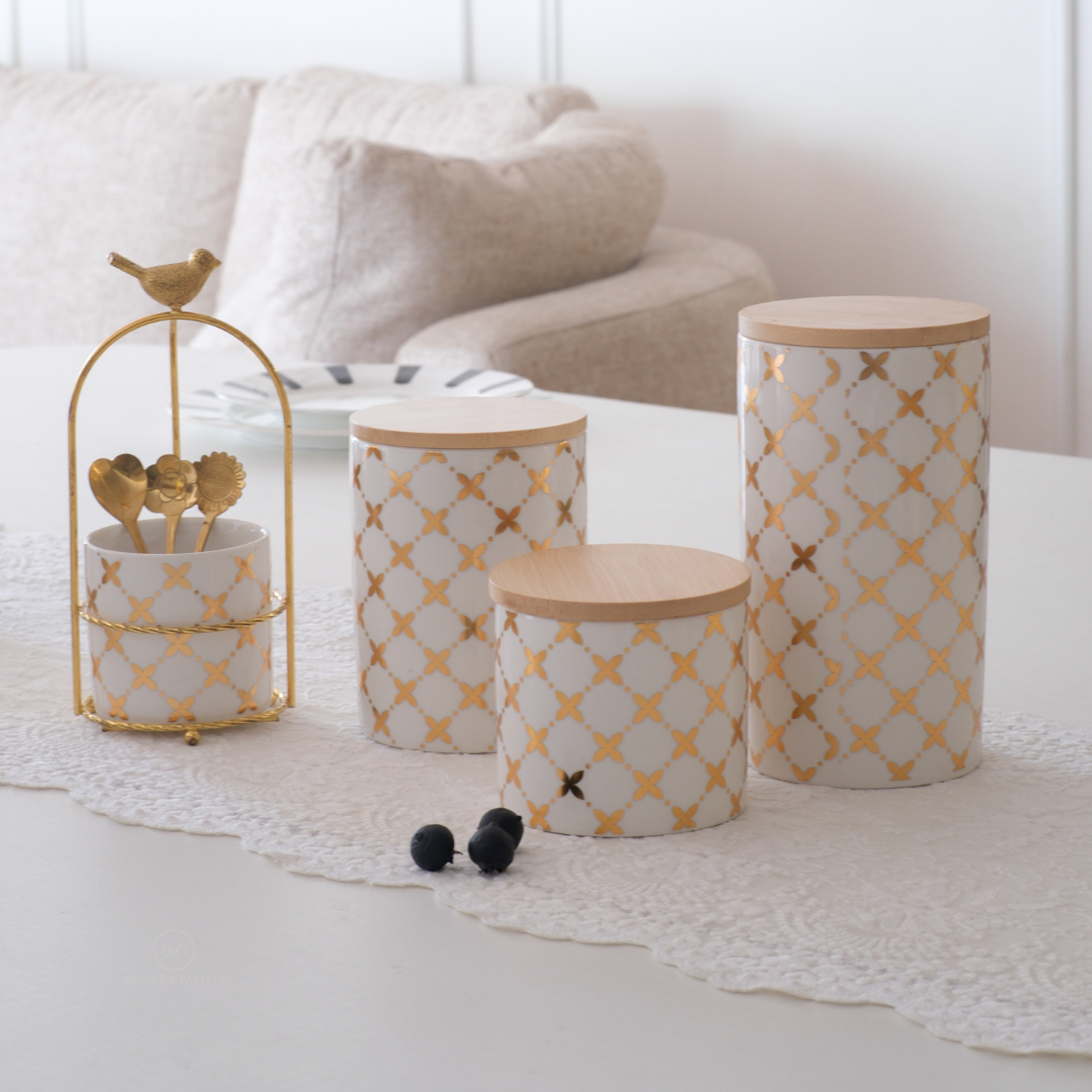 White ceramic kitchen storage containers with gold design
