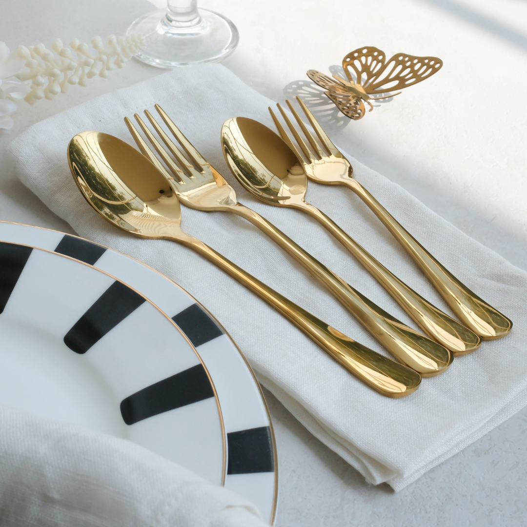 Luxury Gold cutlery placed on white napkin