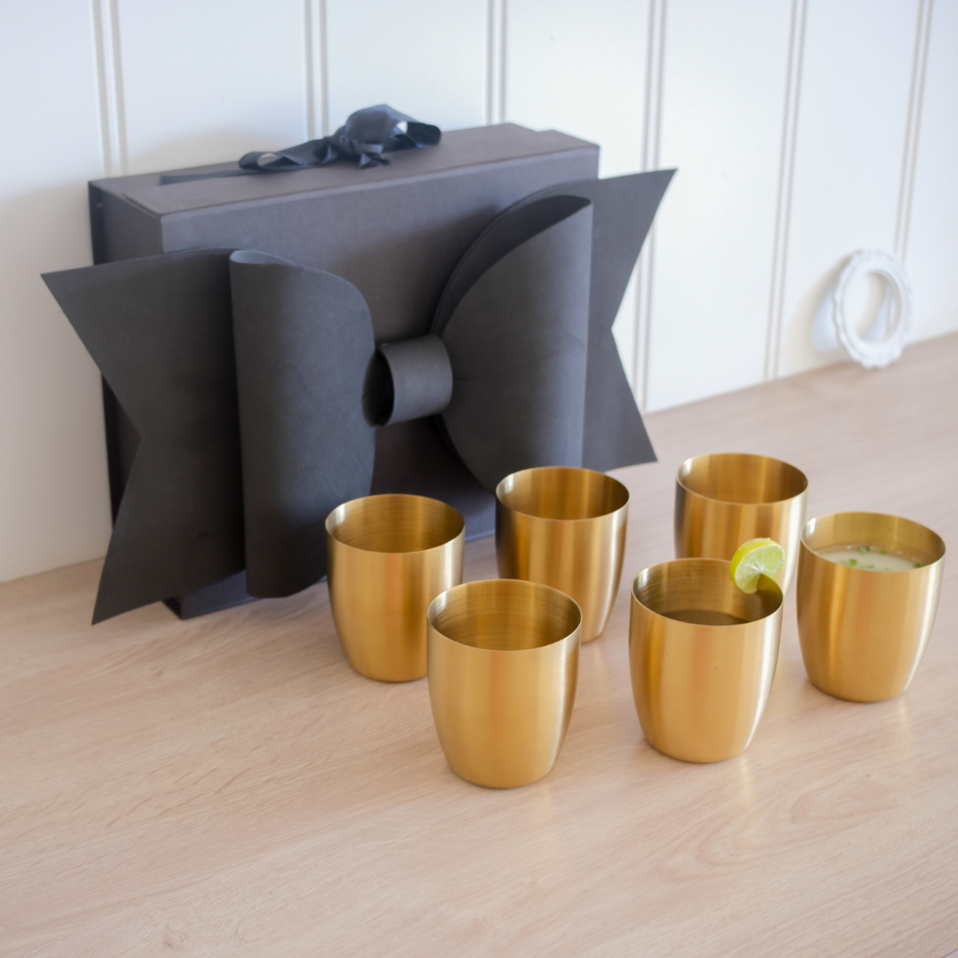 Set of 6 Juice glasses with gift box placed on wooden counter